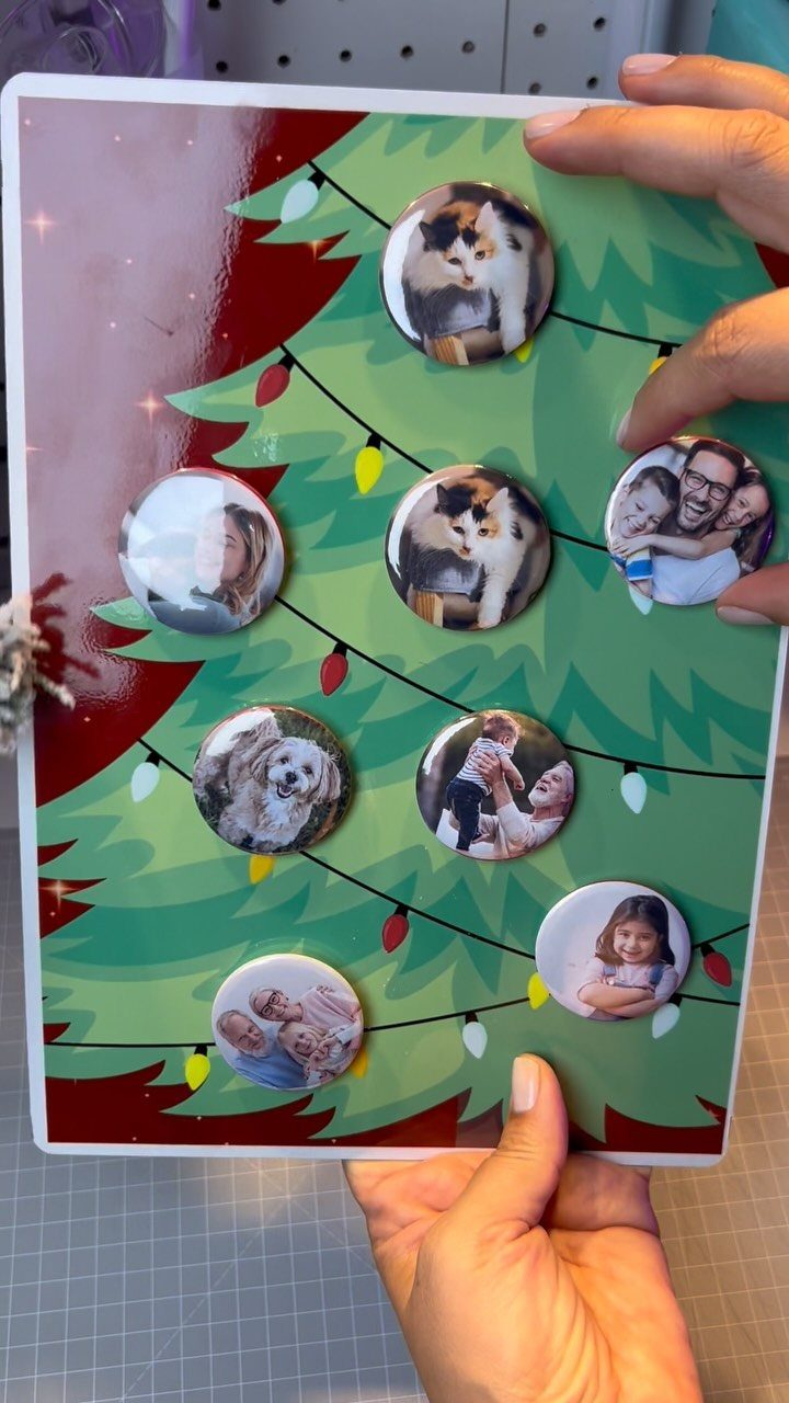 Circular photo magnets of family and pets on a Christmas tree magnetic board