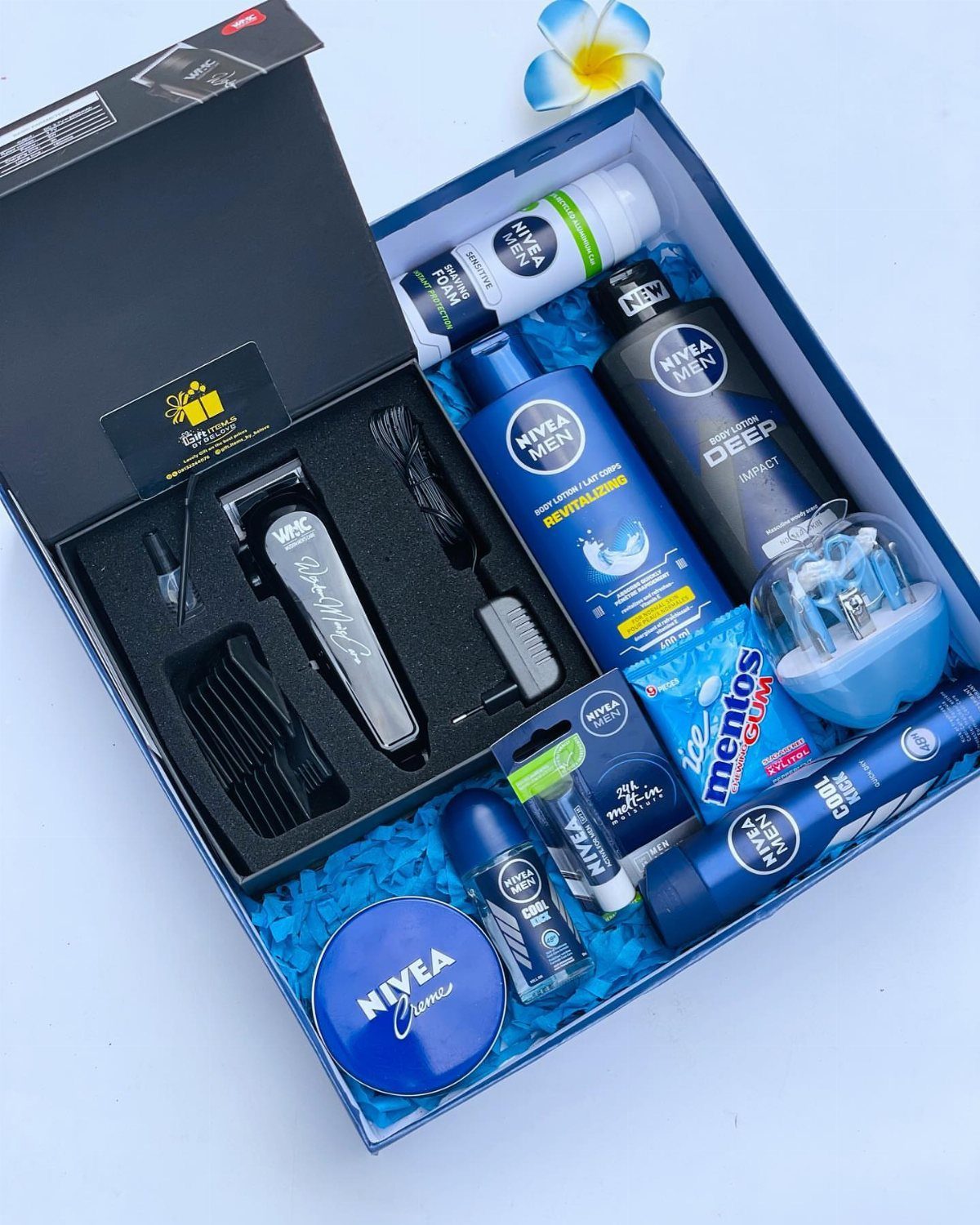 Men's grooming gift set with electric trimmer and Nivea skincare products in blue box