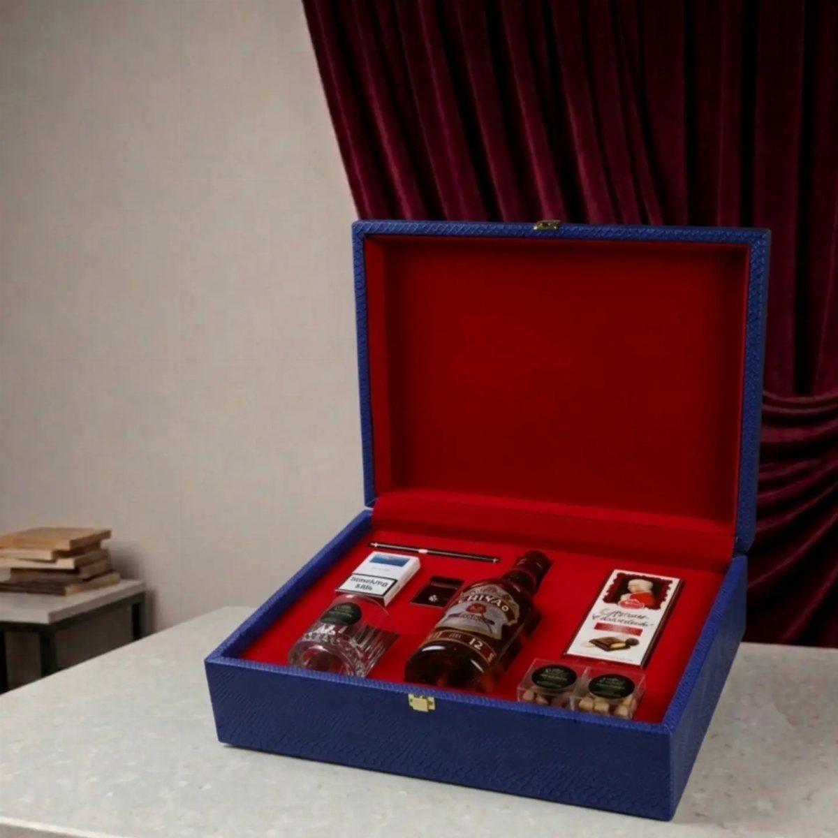Cigar and whiskey gift set in a blue box with red velvet lining.