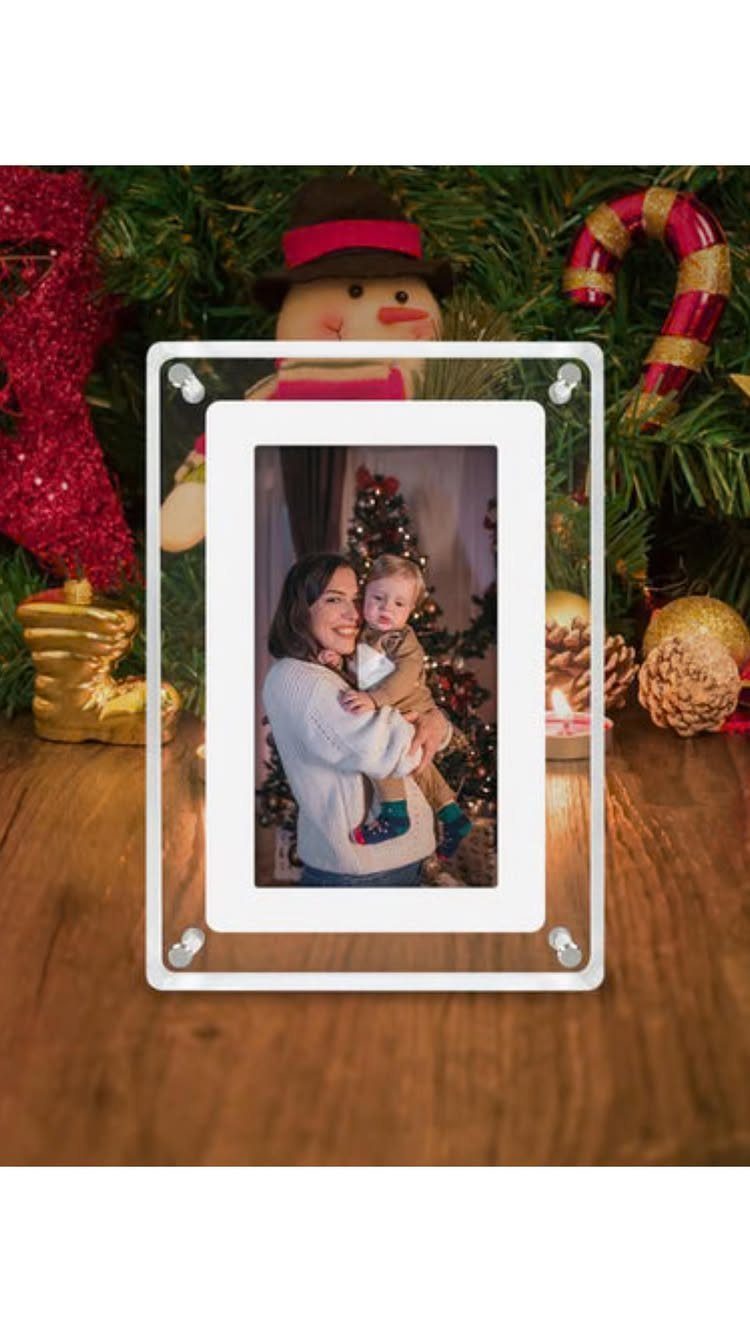 Acrylic photo frame with a family picture in front of a Christmas tree