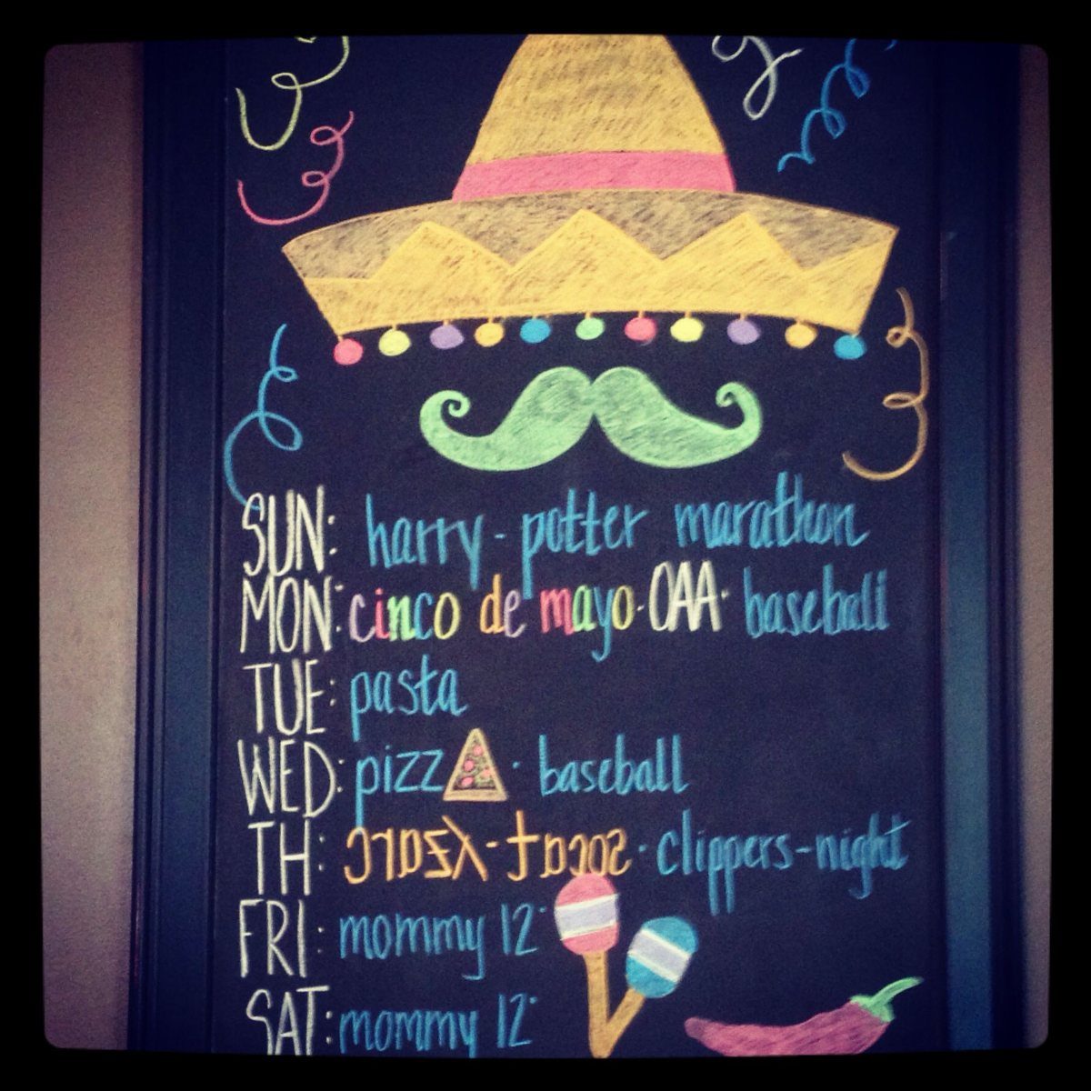 Chalkboard weekly schedule with a sombrero, mustache, and Cinco de Mayo listed.