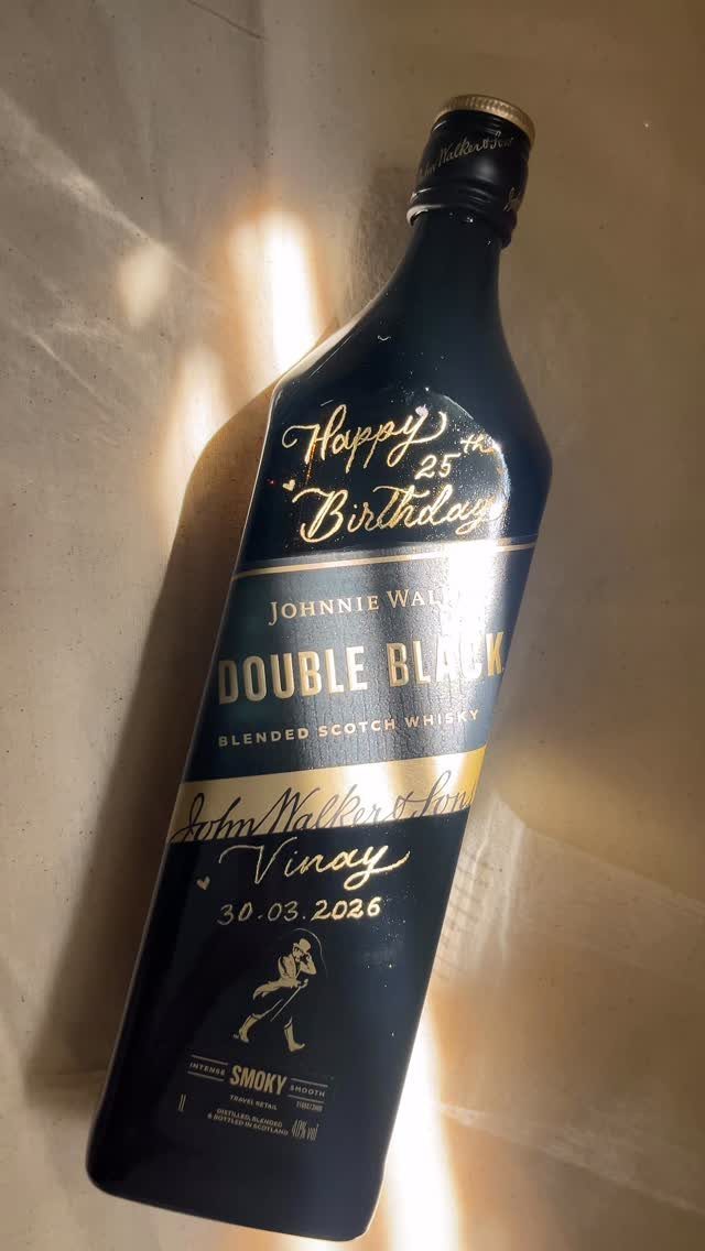 Customized Johnnie Walker Double Black whisky bottle with gold birthday lettering for Vinay