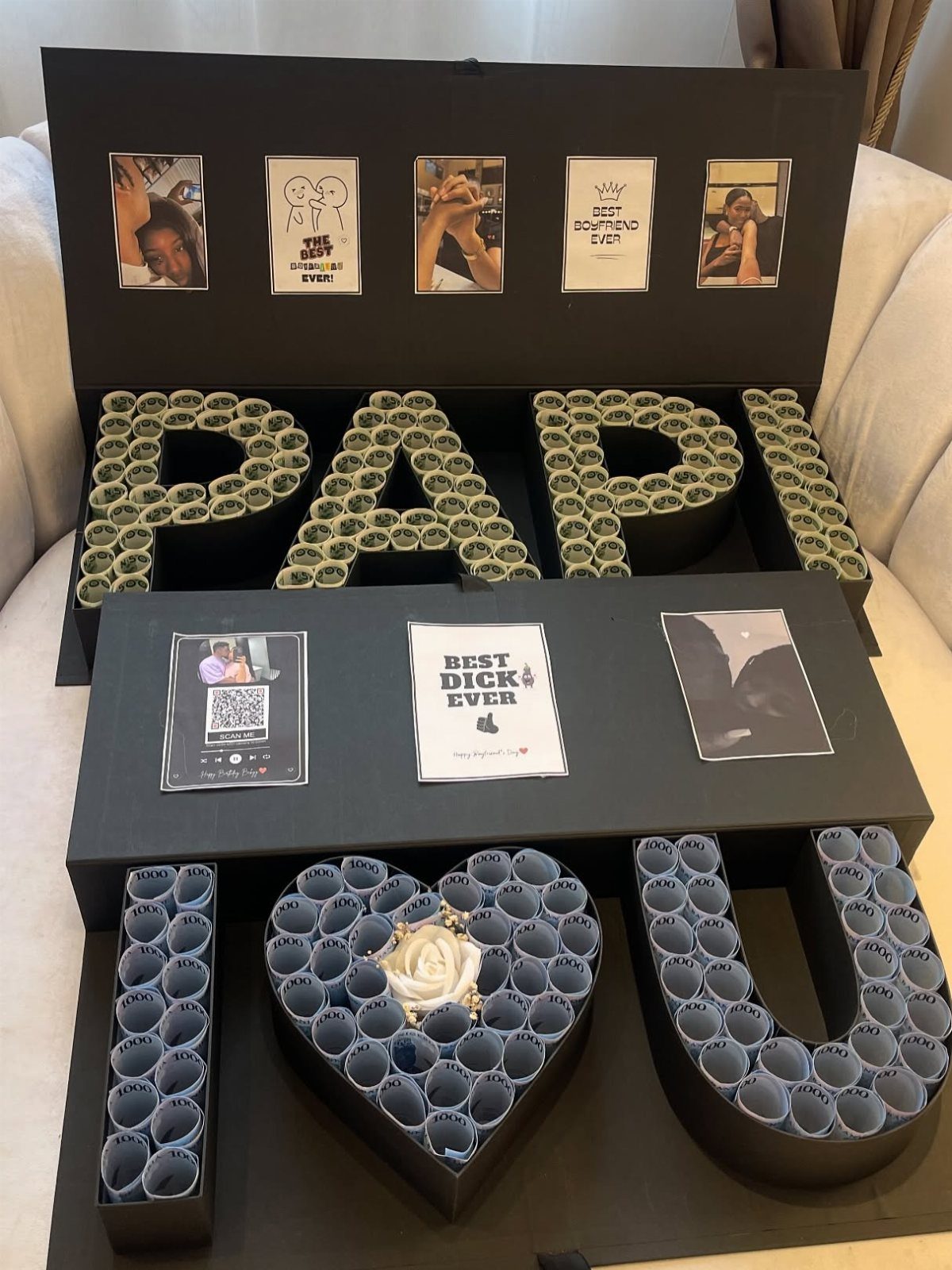 Custom gift box with money art spelling PAPI and blue paper heart and letters.