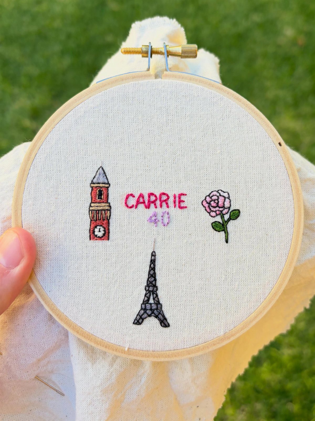 Embroidered hoop art featuring landmarks, a rose, and the name Carrie for a 40th birthday.