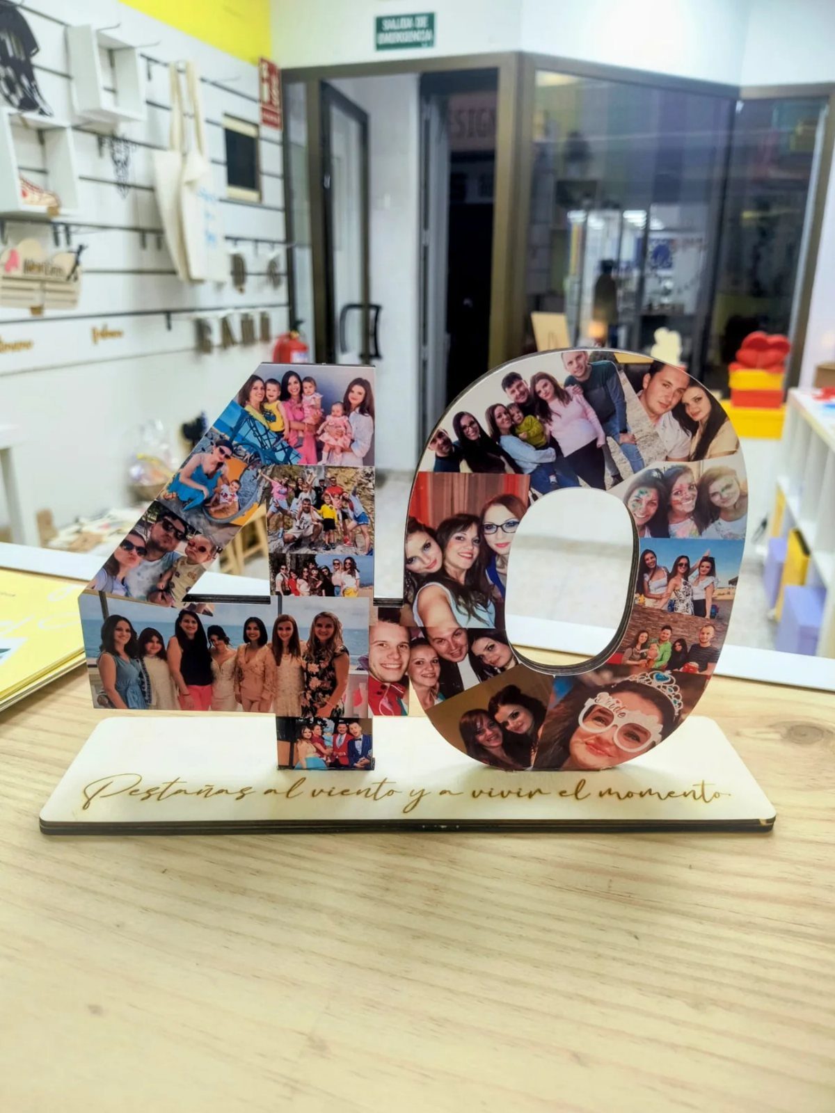Custom wooden number 40 photo collage on a base with engraved text.