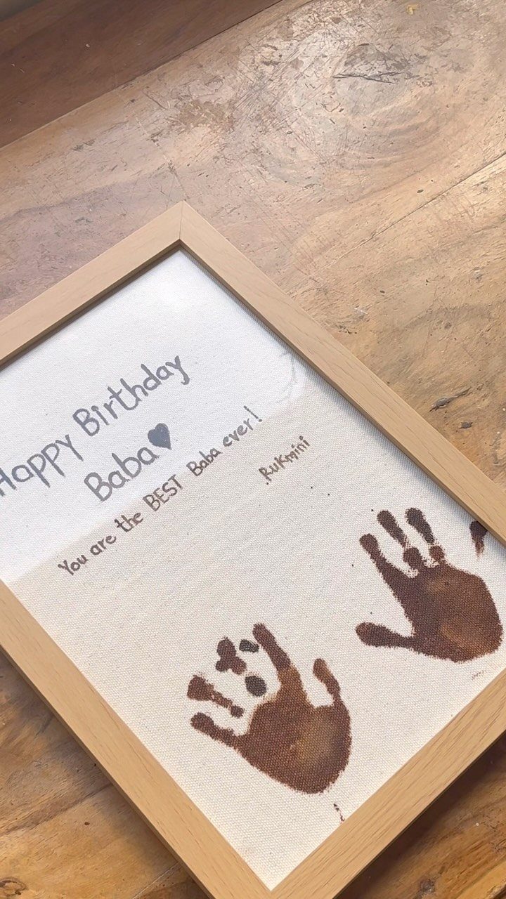Framed birthday art with two brown handprints and a heartfelt message for Baba.