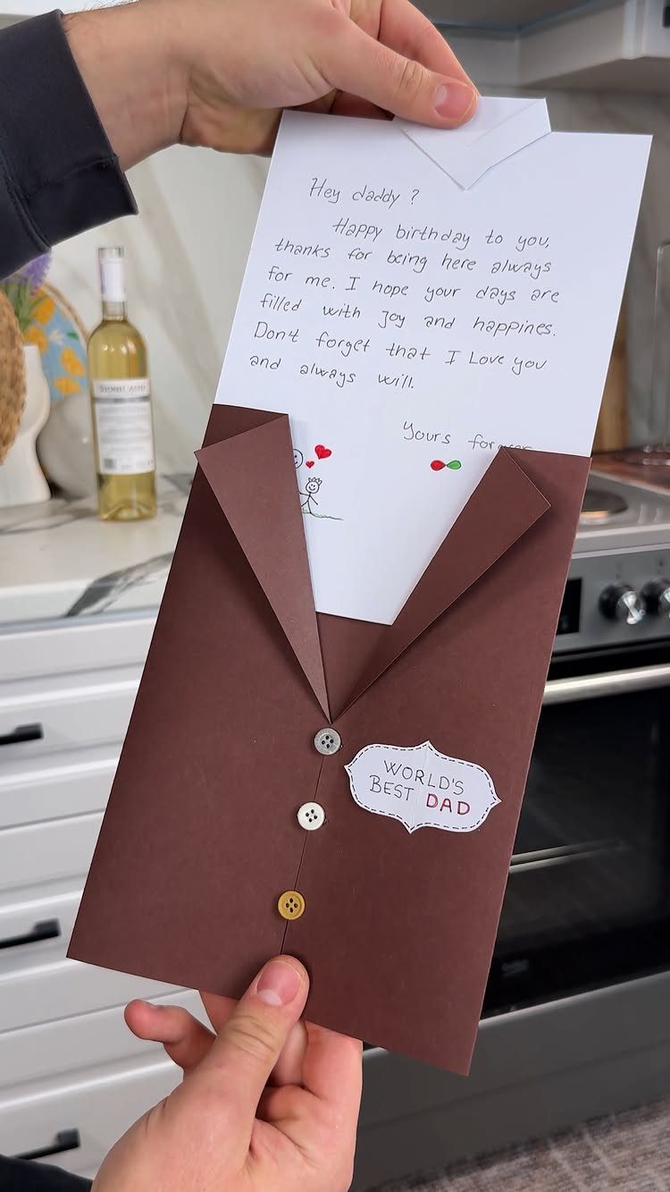Handmade birthday card shaped like a brown suit jacket with a handwritten letter.
