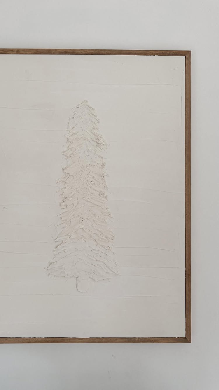 Textured white Christmas tree painting on a white canvas with a wooden frame.