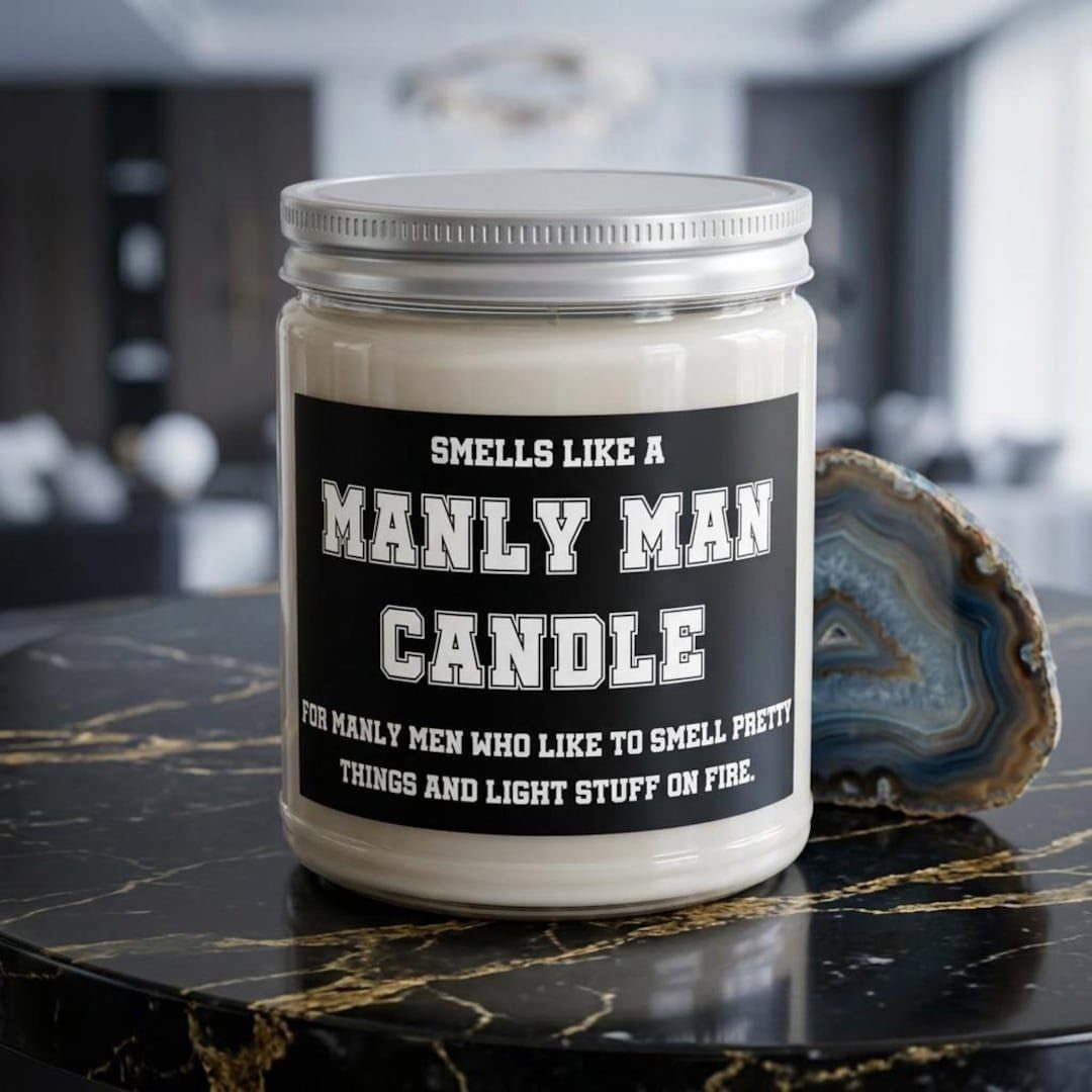 Manly man candle in a glass jar on a black marble table