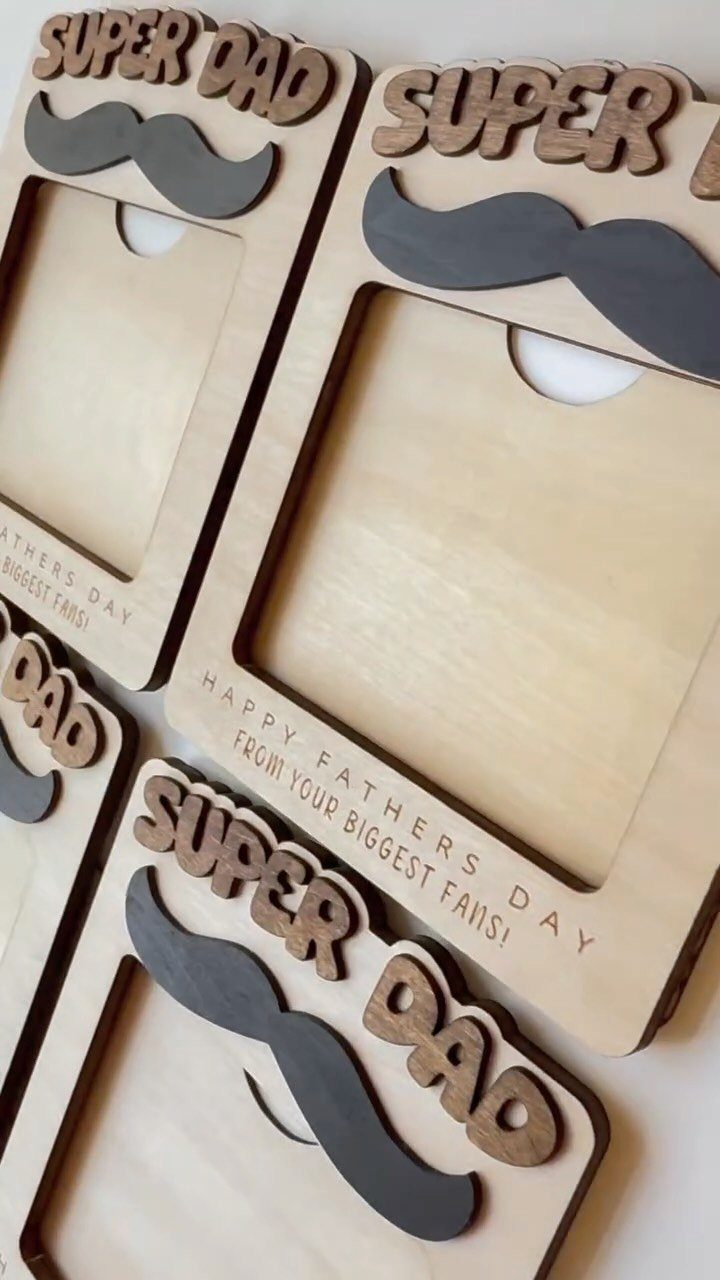 Wooden photo frames for Father's Day with Super Dad text and mustache decorations.