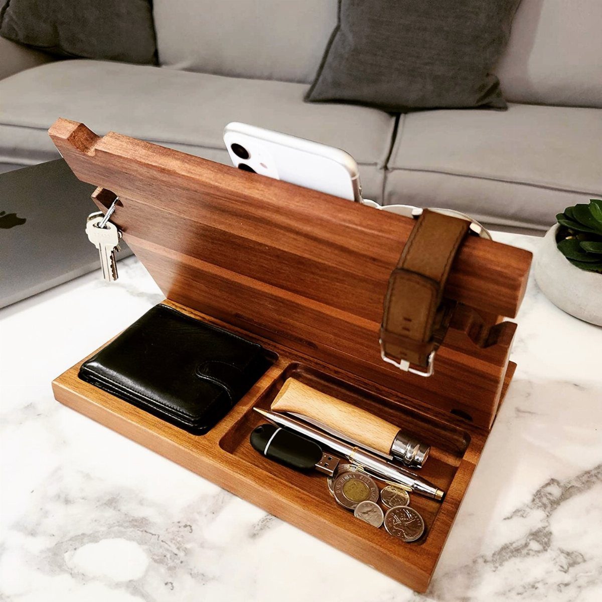 Wooden valet tray and phone stand holding a wallet, keys, and smartphone.