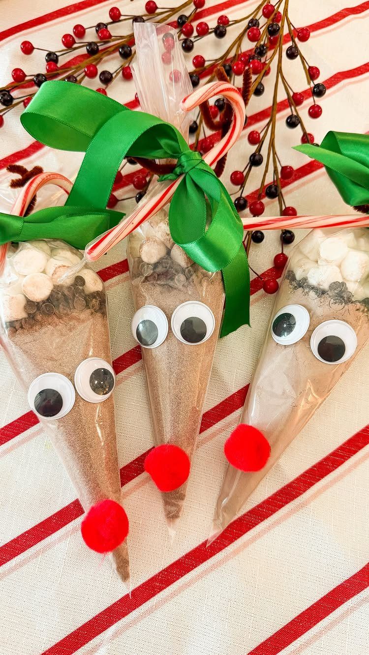 Reindeer-themed hot chocolate mix bags with googly eyes and red pom-pom noses.