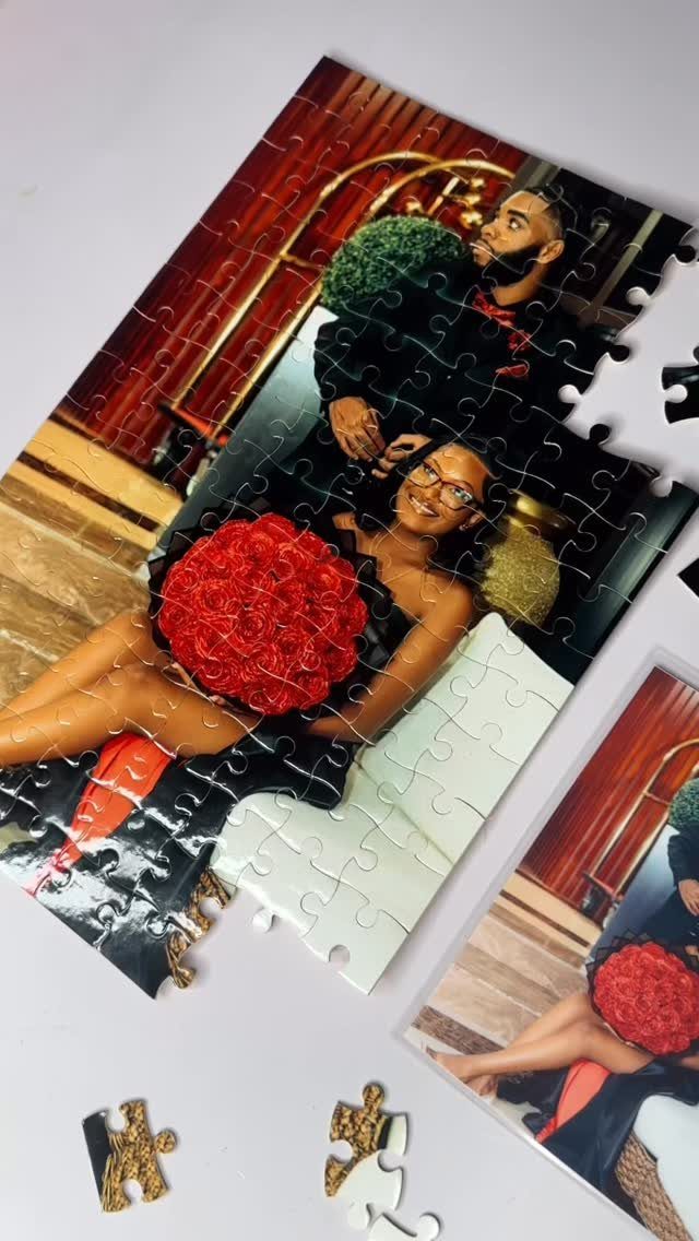 Partially completed custom jigsaw puzzle showing a couple with a red bouquet.