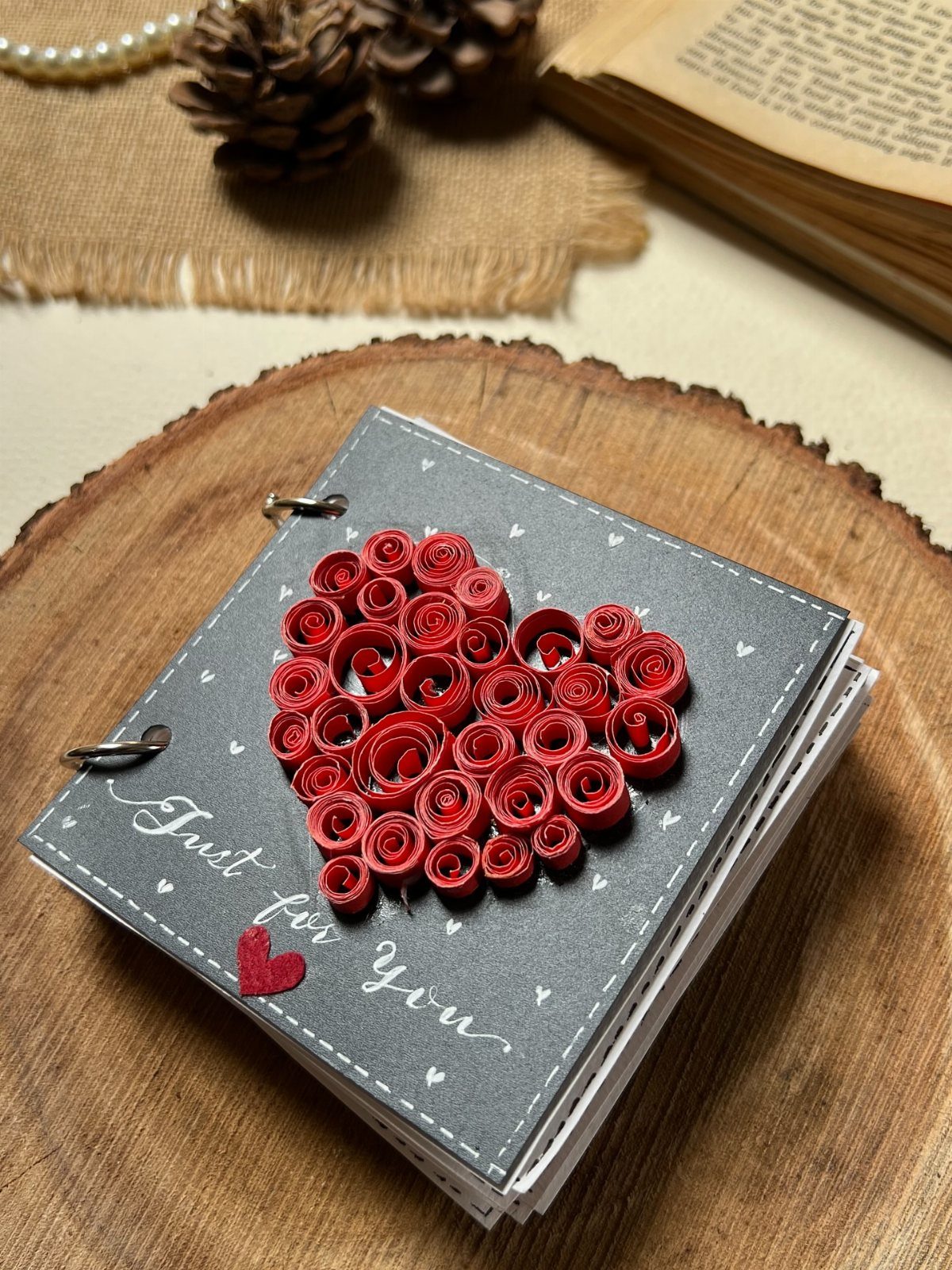 Small grey scrapbook with a red quilled paper heart and Just for You text.