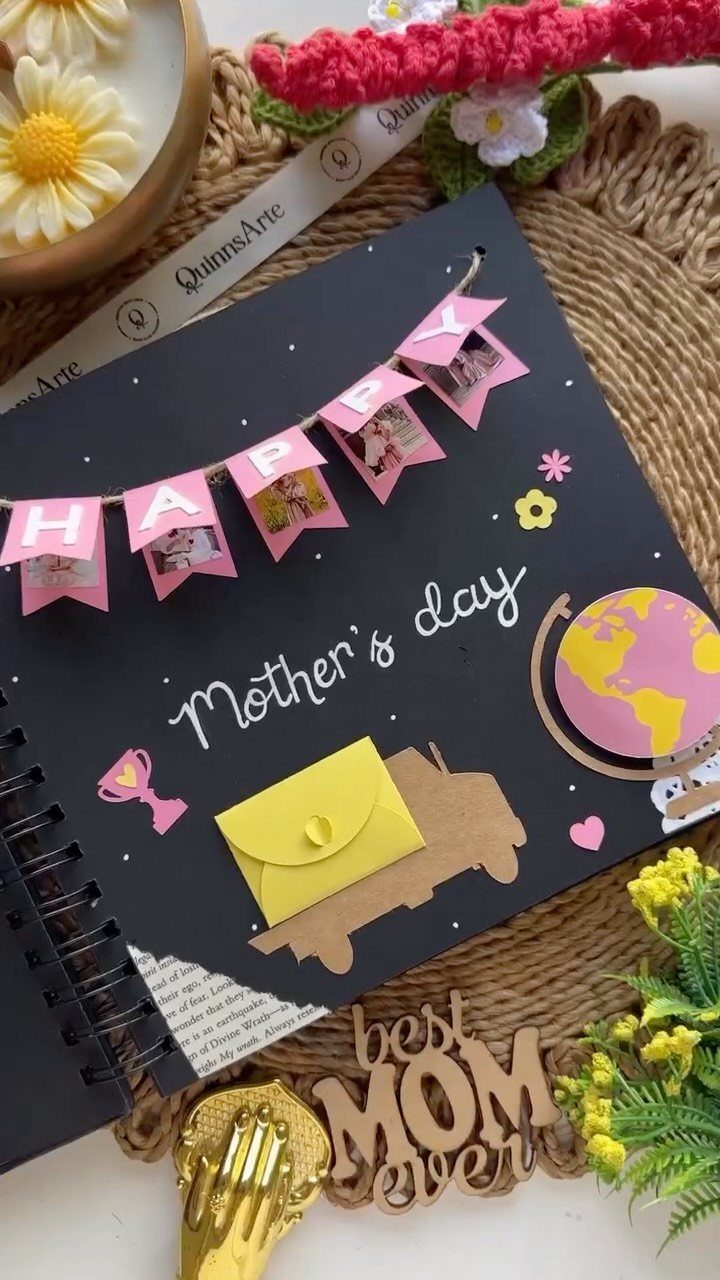 Black spiral scrapbook page decorated with photos, a globe, and Mother's Day text.