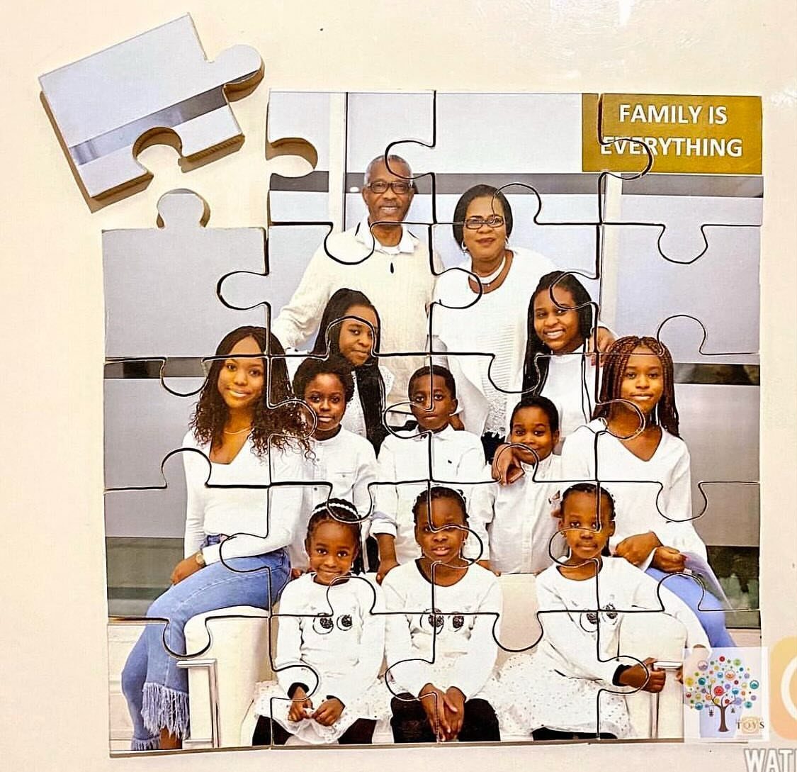 Custom jigsaw puzzle showing a family portrait of parents and children in white.