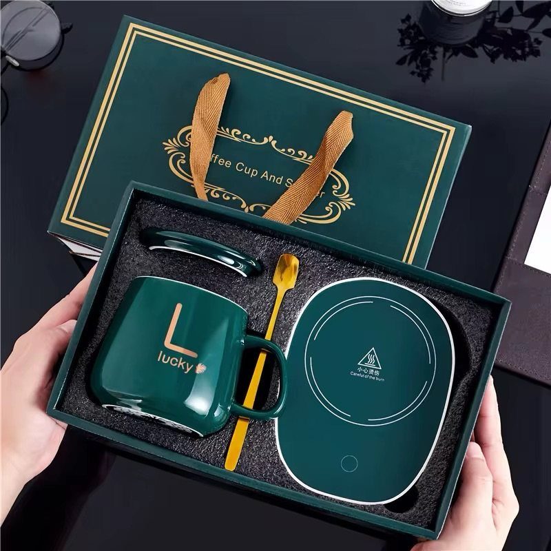 Green coffee mug gift set with gold spoon and warming plate in box