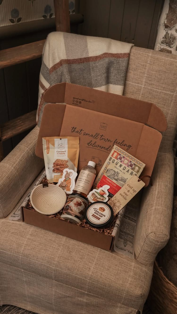 Gourmet gift box with treats and a bowl on a cozy armchair