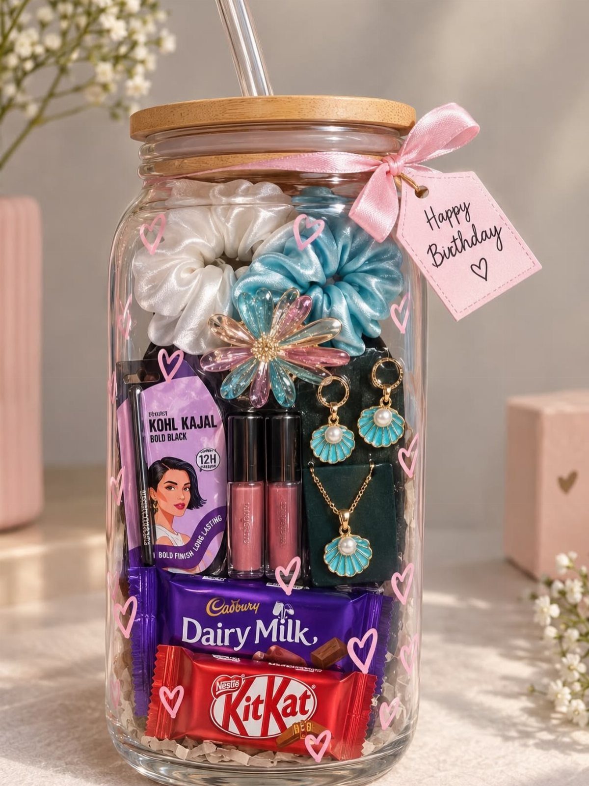 Glass jar gift filled with chocolates, jewelry, and hair accessories with birthday tag.