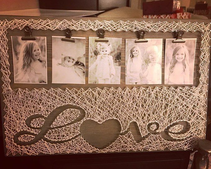 Wooden string art photo frame with five black and white children's photos and Love cutout