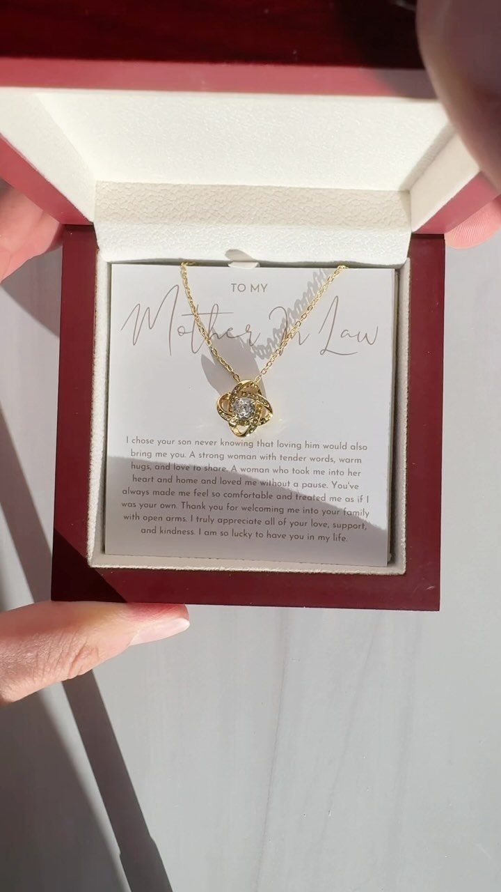 Gold flower pendant necklace in a red box with a Mother In Law card