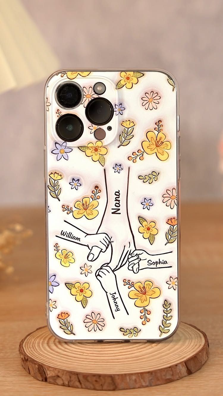 Smartphone case with floral illustration and family names on a wooden base