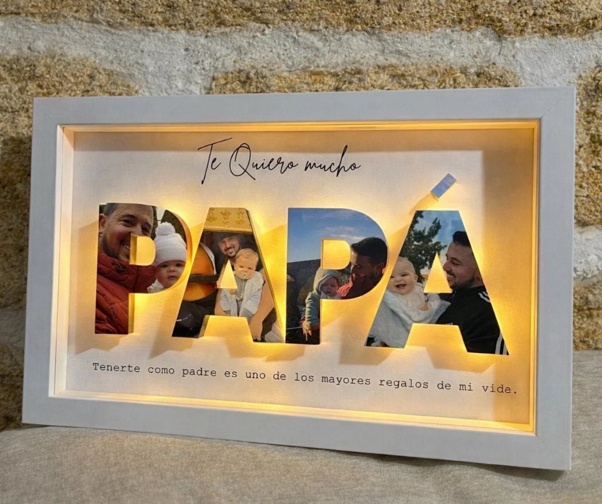 Custom shadow box frame with photos inside the letters spelling PAPÁ and warm lighting