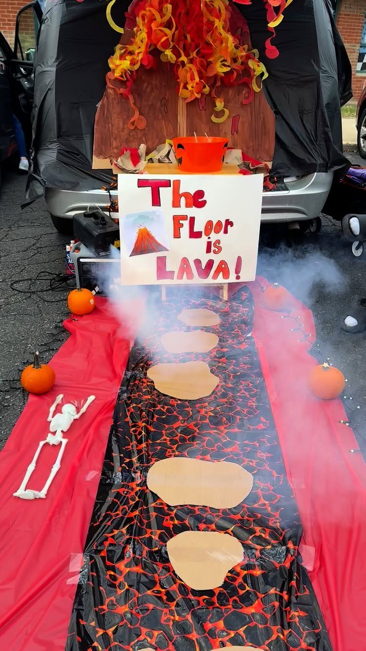 Volcano themed trunk or treat game with lava runner and stepping stones