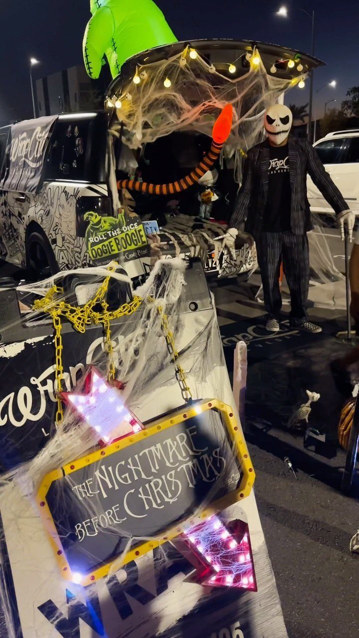 Nightmare Before Christmas themed car trunk with Jack Skellington figure and spooky decorations.
