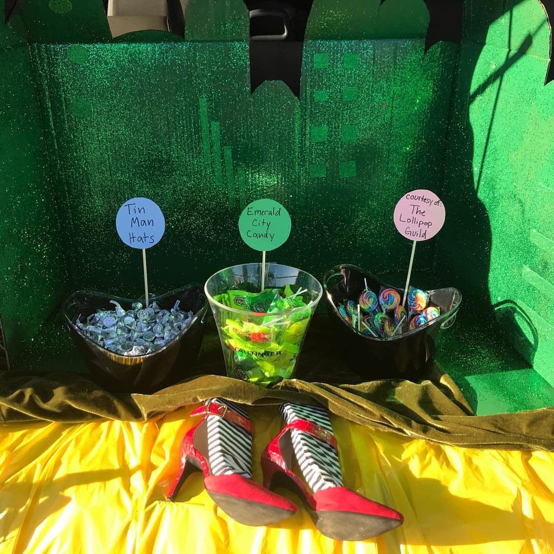 Wizard of Oz themed car trunk with ruby slippers and Emerald City backdrop.