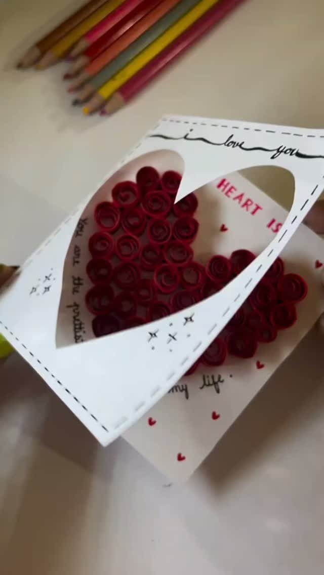 Handmade Valentine's Day card with a heart filled with red paper roses.