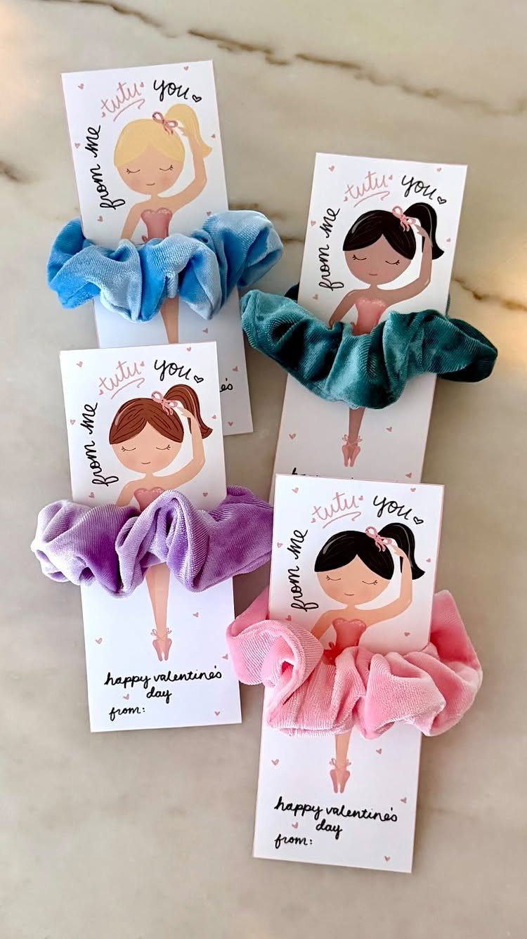 Velvet scrunchies in various colors attached to Valentine's Day ballerina gift cards.