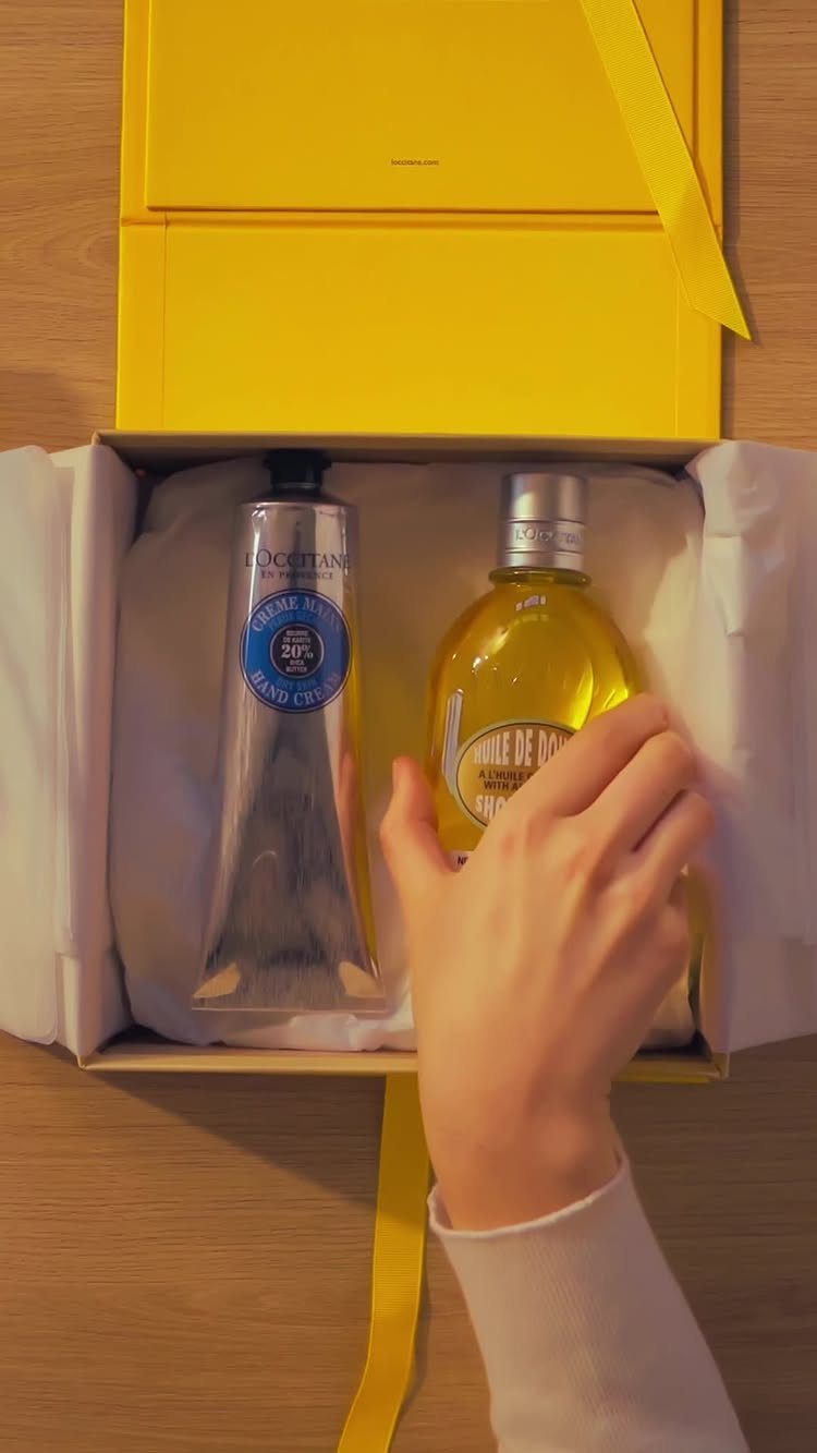 L'Occitane skincare set with hand cream and body oil in a yellow box.