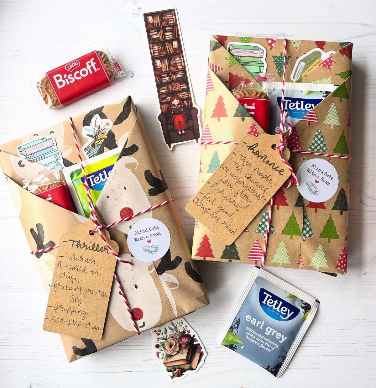 Wrapped book gift bundles with tea, biscuits, and genre tags on white background
