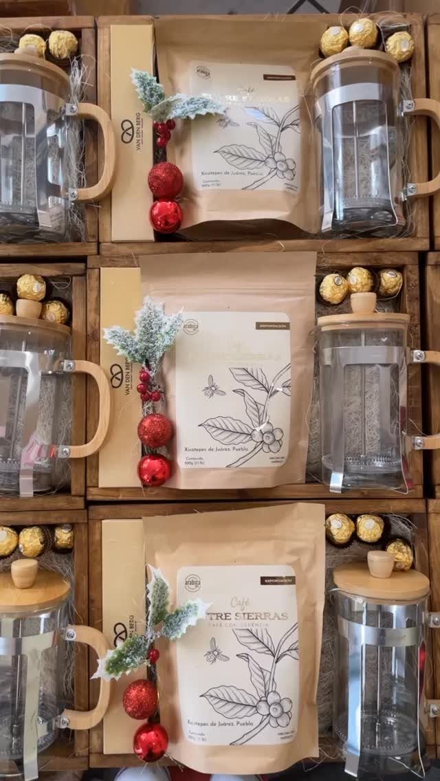 Coffee gift sets in wooden boxes with French presses and gold chocolates.